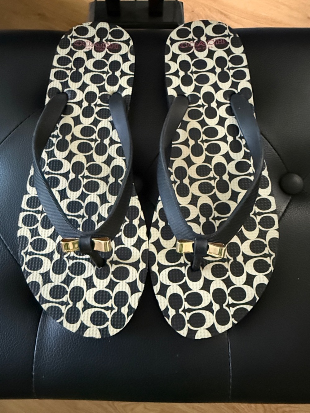 Coach Black and Cream Logo Flip Flop Sandals with Gold Accent